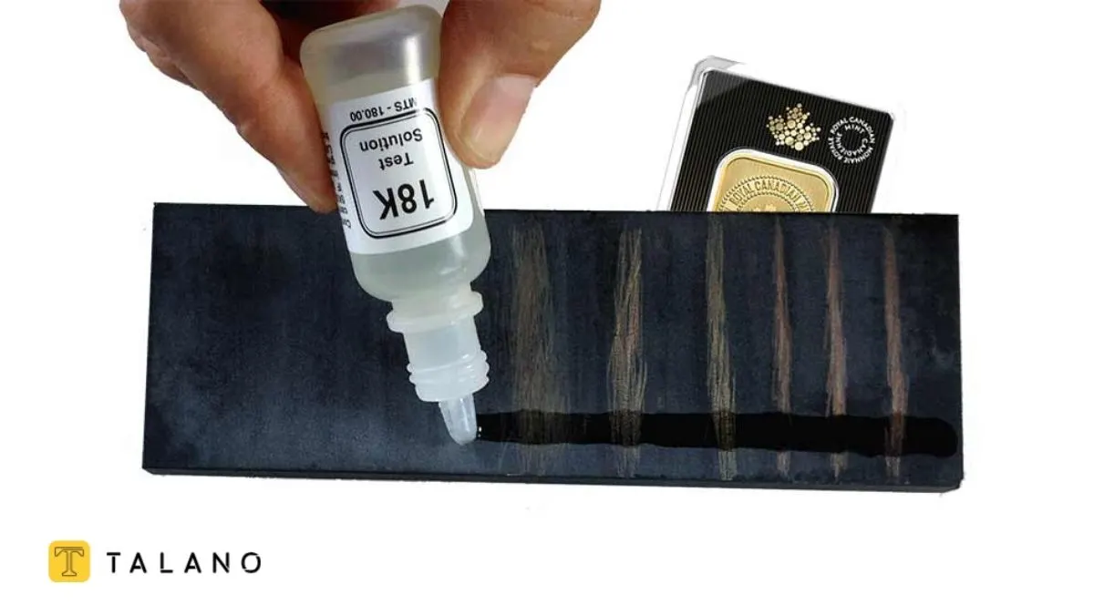 واکنش طلا با محلول تیزاب روی سنگ محک